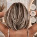Femme avec un bob blond cendré, mettant en valeur la coupe moderne et élégante.